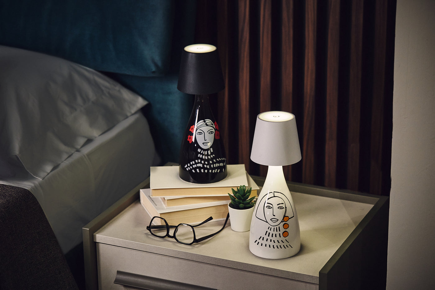 set of ceramic olive oil bottles with led lamp included, hand painted in italy on a bedroom table