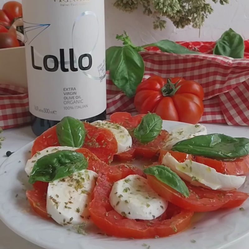Vignoli Lollo Organic Extra Virgin Olive Oil front of 16.9oz bottle with tomato, basil and mozarella