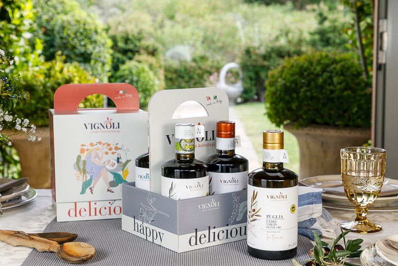 Vignoli PREMIUM Italian Extra Virgin Olive Oil & Balsamic Vinegar Serving Set front of bottles in box with garden background