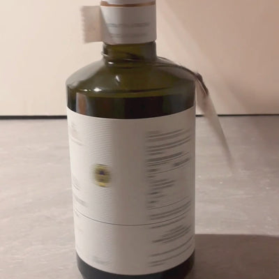 Vignoli Extra Virgin Olive Oil IGP Puglia - Intense front of 16.9oz bottle being poured and brushed over yams